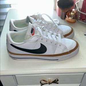 Nike women White Low-Top Sneakers with Black Swoosh and Brown Accent